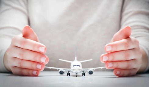 travel-insurance-hands-plane.jpg